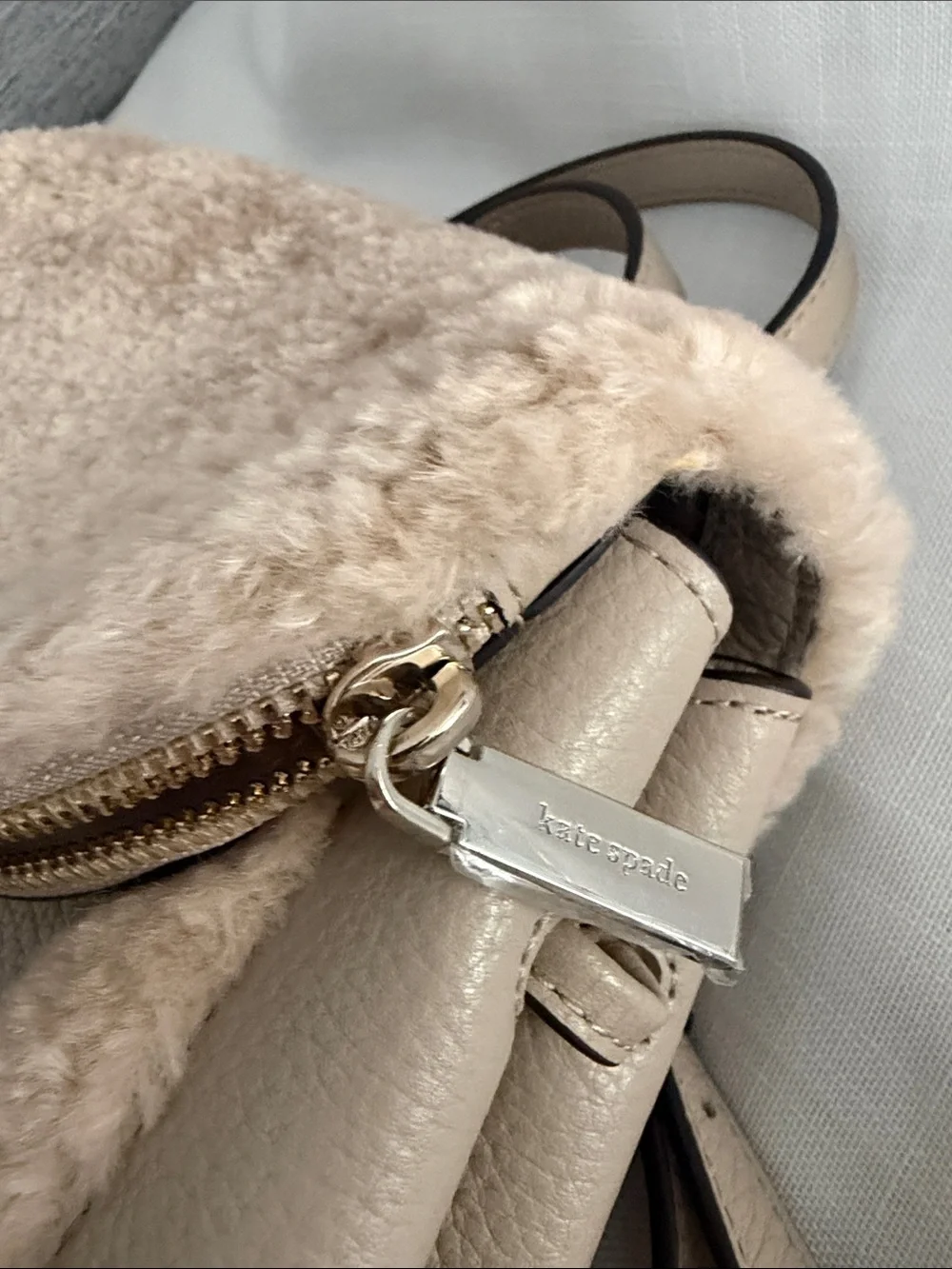 kate spade beige faux-shearling flap backpack
